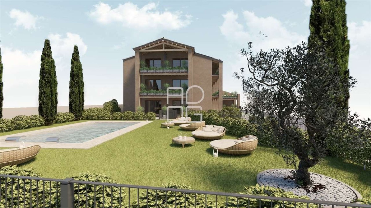 Moderna residenza circondata dal verde con piscina